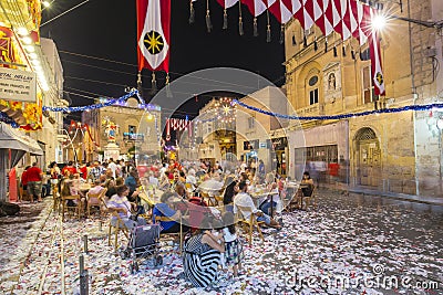 MOSTA, MALTA - 15 AUG. 2016: The Mosta festival at night with celebrating maltese people Editorial Stock Photo